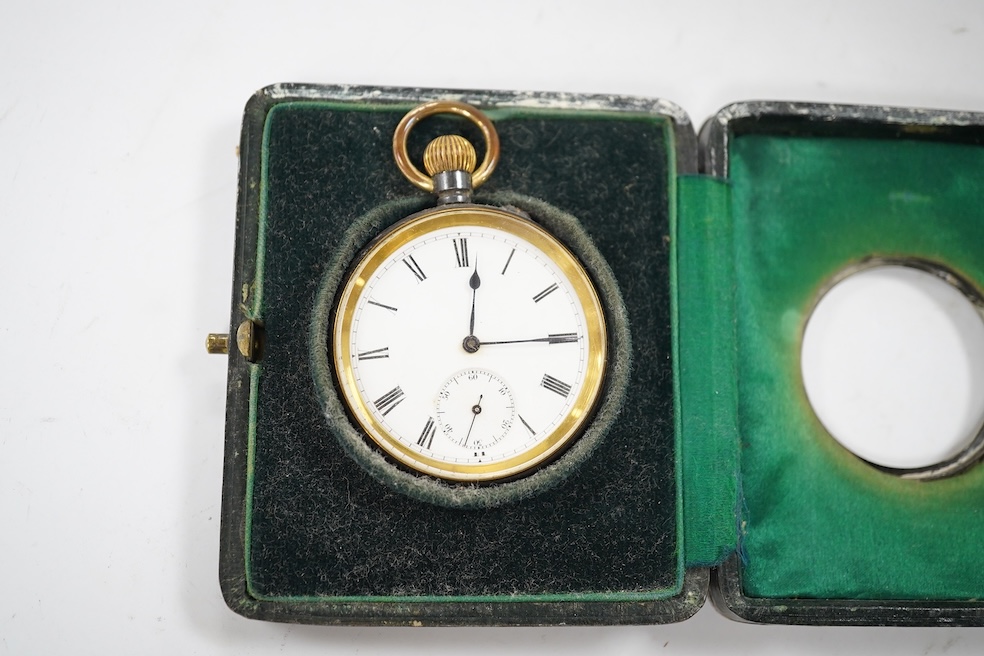 An Edwardian silver mounted leather travelling watch case, Birmingham, 1904, 95mm, with a gun metal cased pocket watch. Condition - poor